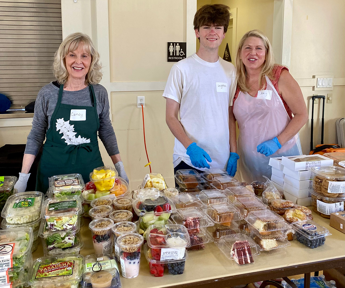 Photo of Volunteers serving food at CCSM