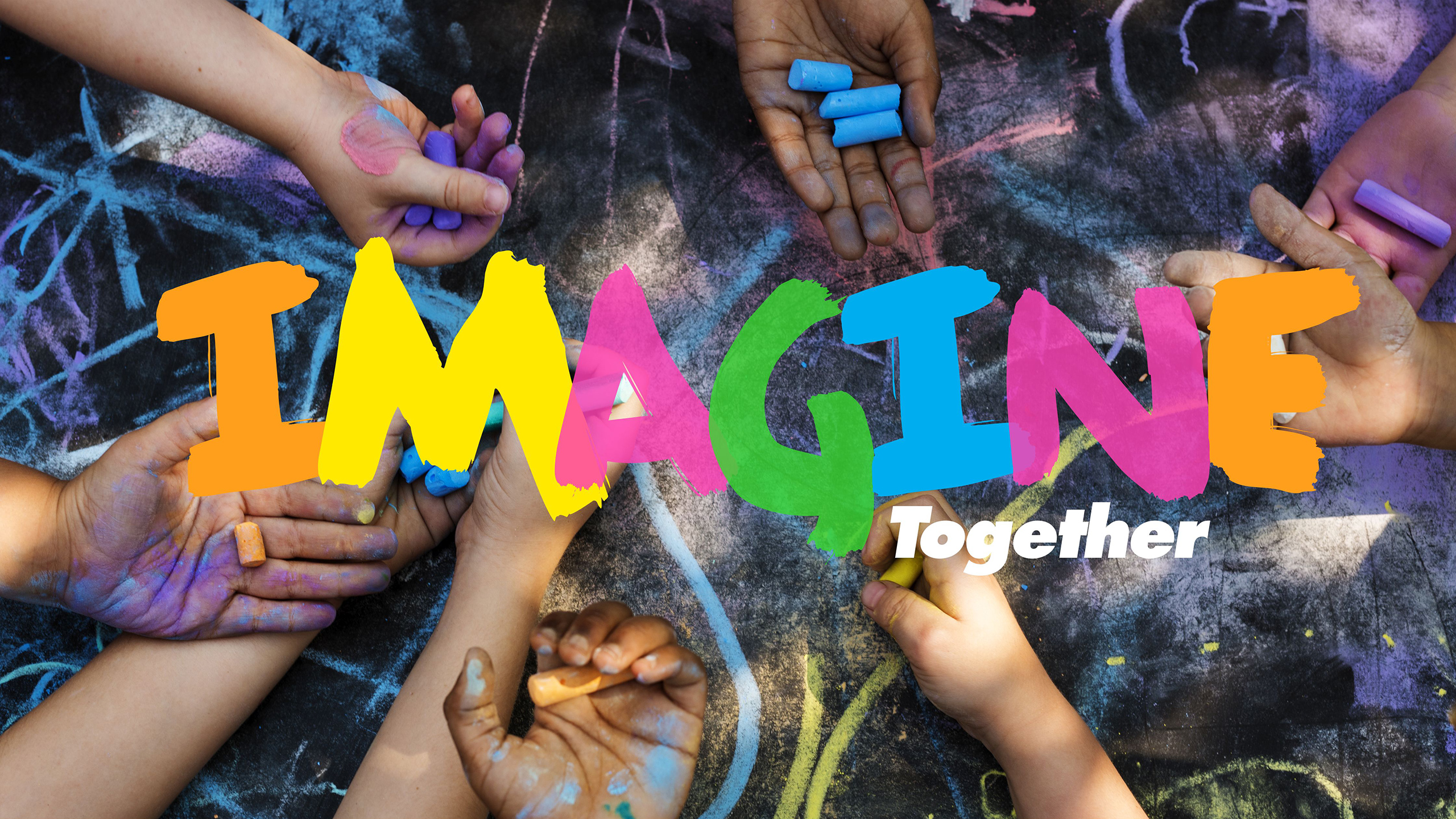 Picture of hands with chalk, text reads Imagine Together